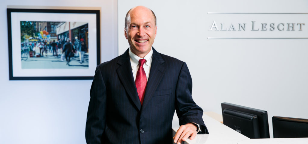 Alan Lescht posing in Alan Lescht and Associates Office