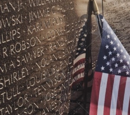 Washington DC Vietnam wall with names and American Flag