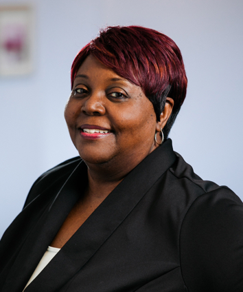 Joyce Dozier Smiling Side Team Headshot